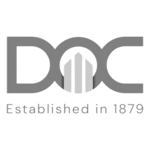DOC Construction grayscale logo - a client of HammerTech and a user of HammerTech's construction intelligence safety software for better site safety.