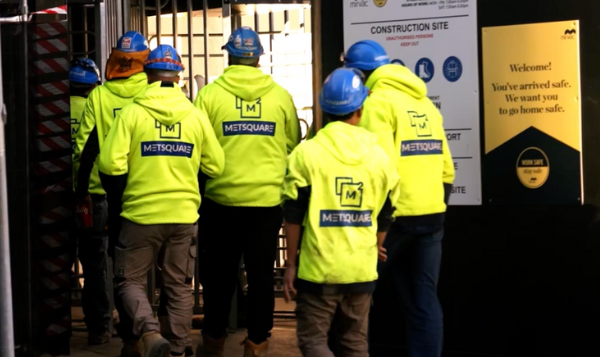 Irongate site access on a construction site that integrates seamlessly with HammerTech, showing 5-6 construction workers.